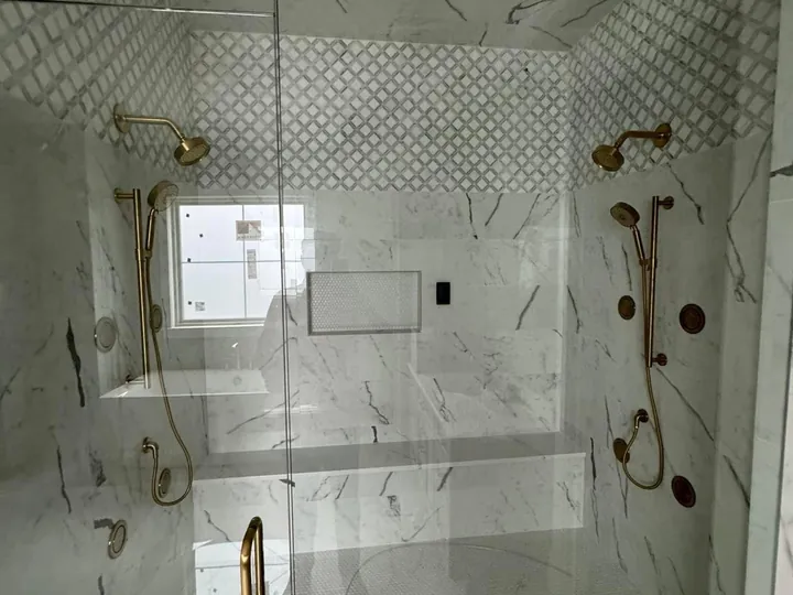 Luxury marble shower with gold fixtures